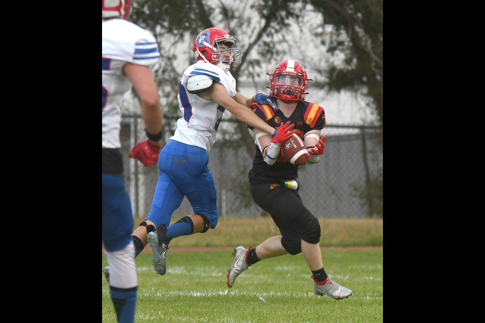 Colts defensive back Isaac Siemens just managed to knock this ball away from Central receiver Carter Connolly.