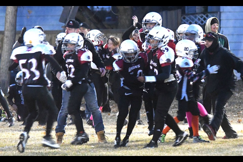 The Moose Jaw Lions celebrate after their overtime win over Estevan.