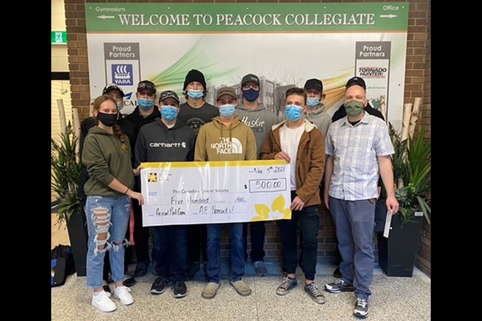 Members of the Peacock Tornadoes football team presented the Canadian Cancer Society with a cheque for $500 last week, proceeds from their annual Pink Game earlier this season.