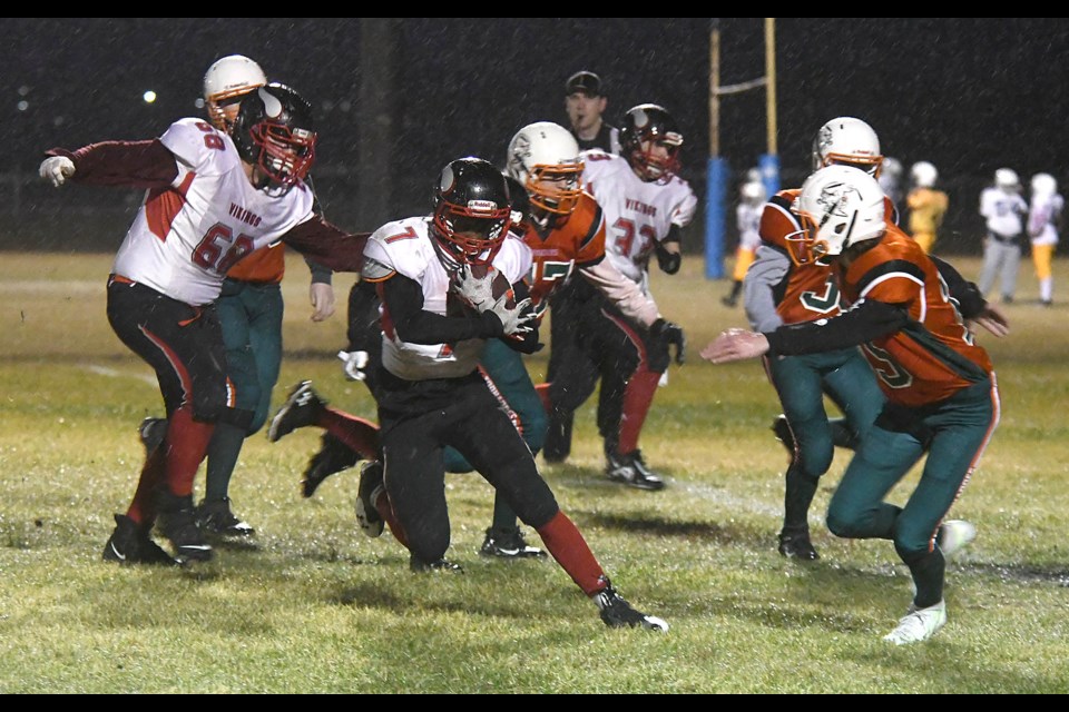 Vanier running back Natan Shiferaw looks for running room in the rain.