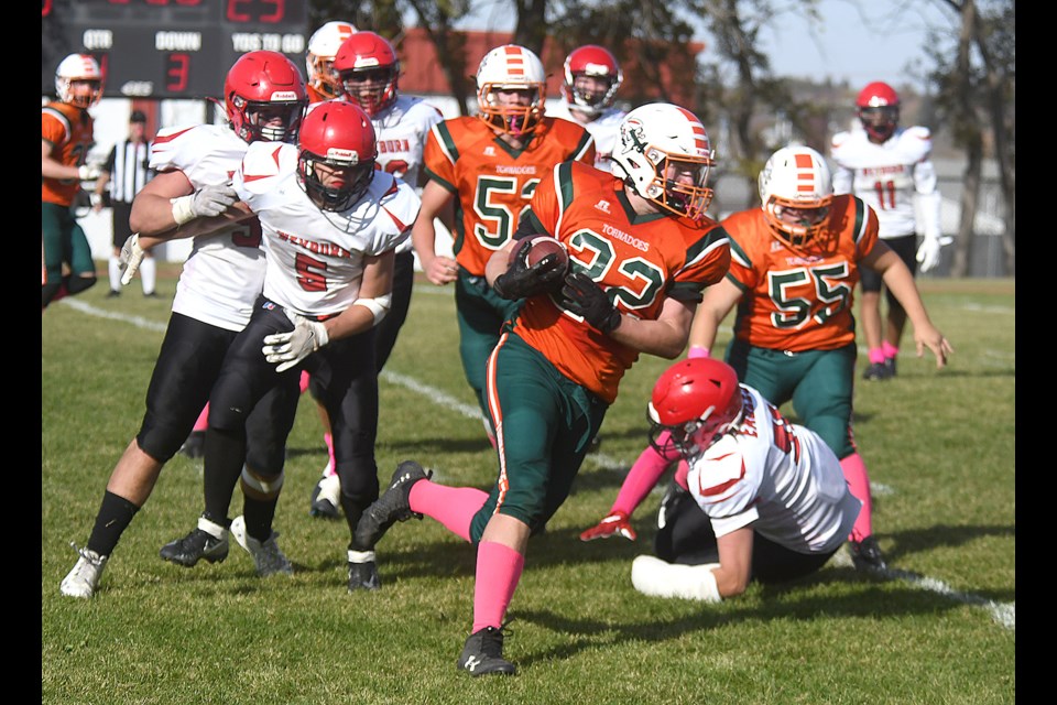 Peacock running back Josh Johnson gets to the outside against the Weyburn defenders.