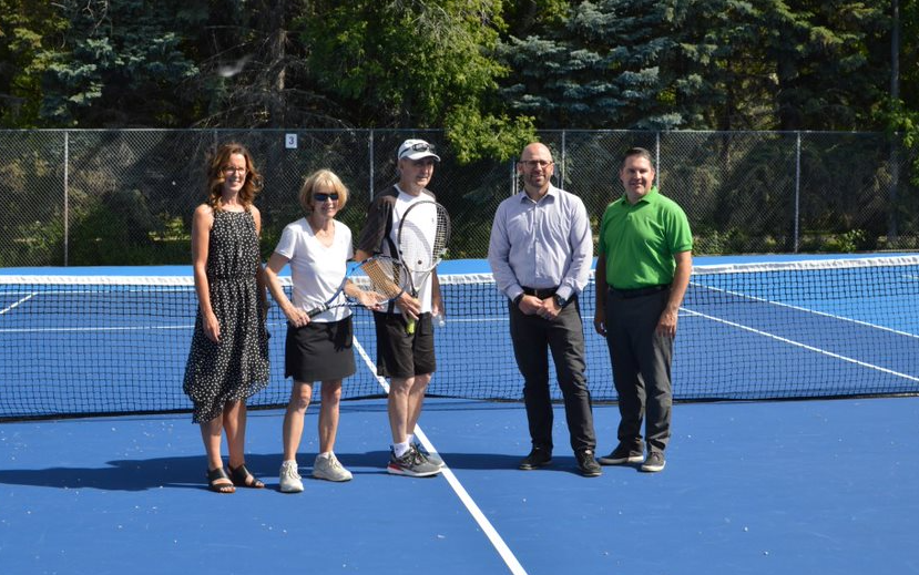 Dawn Luhning, Regina Sagal-Hendry, Andy Shepherd, Derek Blais, and Scott Osmachenko on the new tennis court in front of the net | City of Moose Jaw