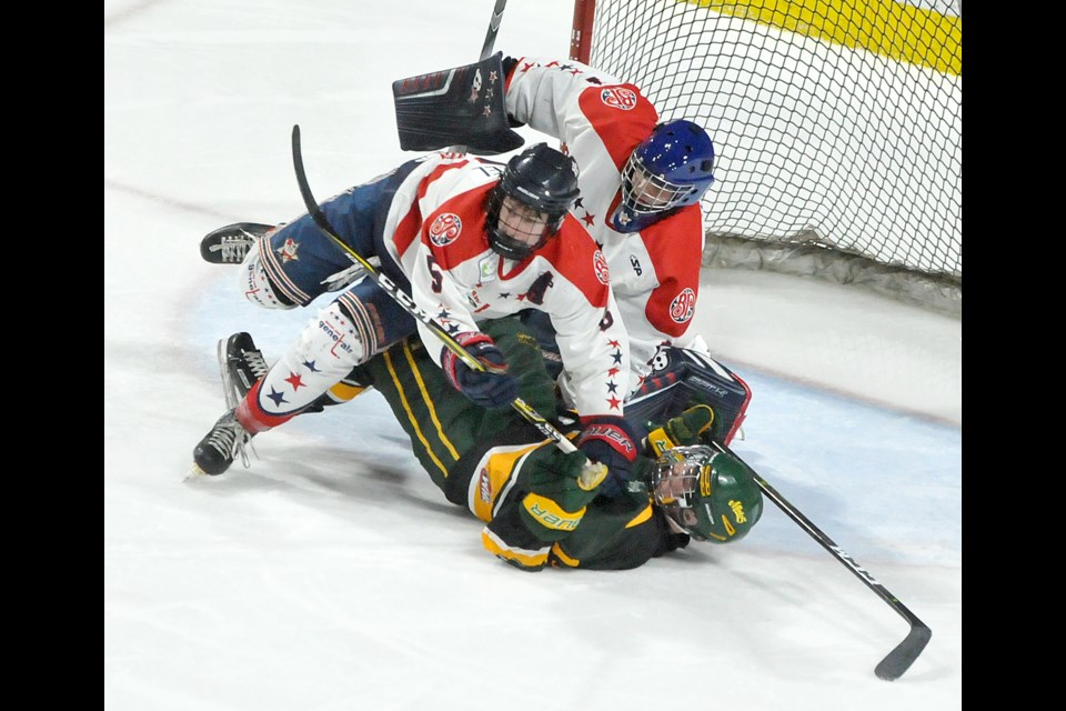 Prince Albert Mintos forward Gavin Ingram got a bit of a rough ride after running into Generals goaltender Jaxson Taupert and drawing the ire of defender Jeron Kletzel. Randy Palmer photograph