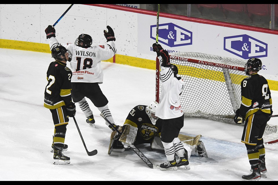 The Warriors celebrate after Orin Olson’s goal late in the second period.