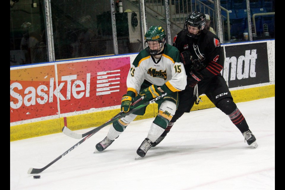 Warriors forward Kirk Mullen keeps a close eye on Prince Albert’s Chase Pauls in the corner. Lucas Punkari/Prince Albert Daily Herald photo