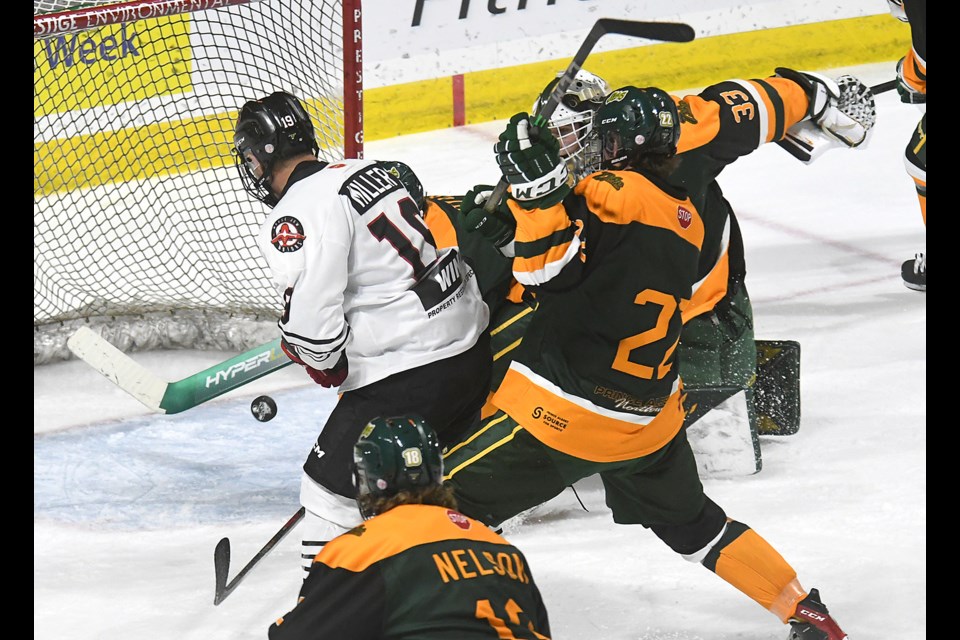 Warriors forward Connor Miller got just enough of this puck to knock it into the Mintos’ net for the game’s opening goal.