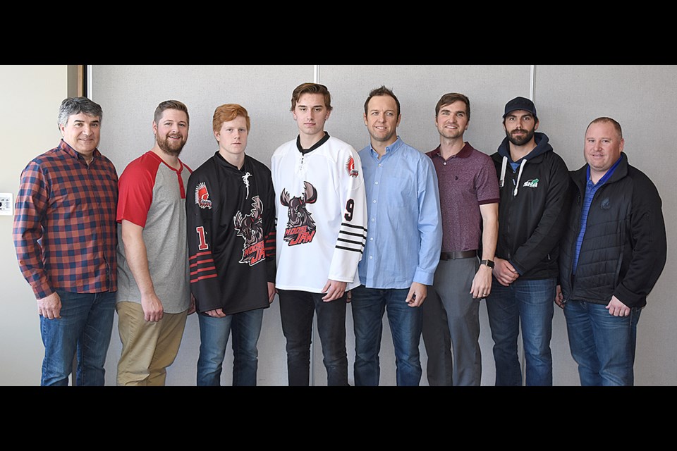 Members of the Moose Jaw Warriors, AAA Warriors and Moose Jaw Minor Hockey pause for a group photo after the press conference announcing the name change new association between the organizations. Bob Dougall (WHL Warriors board of directors), Patrick Boyle (president, Moose Jaw Minor Hockey), Steven Kesslering (AAA Warriors veteran), Ben Wourms-Rowe (AAA Warriors veteran), Trevor Weisgerber (AAA head coach), Carter Davis (AAA assistant coach), Carter Smith (AAA assistant coach), Jeremy Ebbett (AAA Warriors general manager).