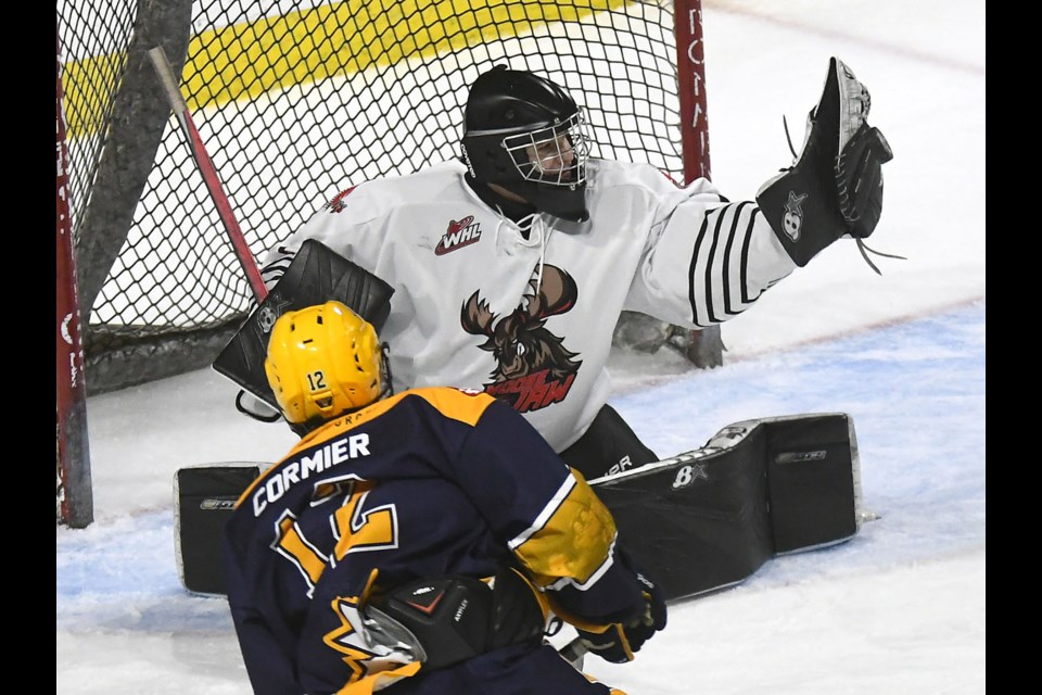 Jaxson Taupert makes the glove save on Swift Current’s Carter Cormier.