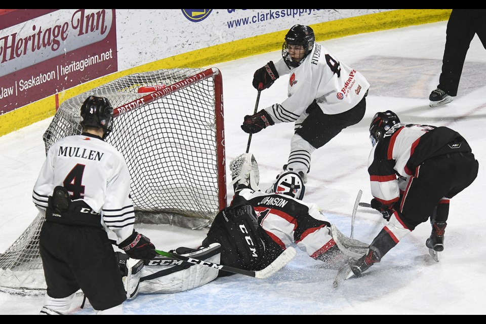 AAA Warriors forward Caelan Fitzpatrick scores after taking a pass from Kirk Mullen.