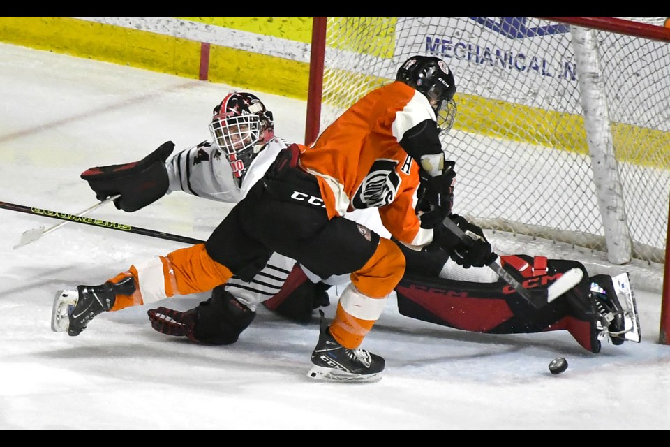 WINMAR Warriors goaltender Luke McKechnie gets across for a big breakaway save on Saskatoon’s Rylan Hue.