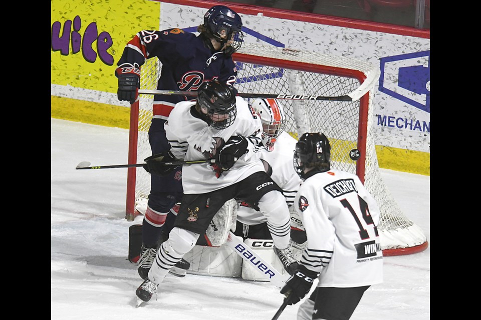 The post is sometimes a goaltender’s best friend, as this shot through traffic on Ryan Bain shows.