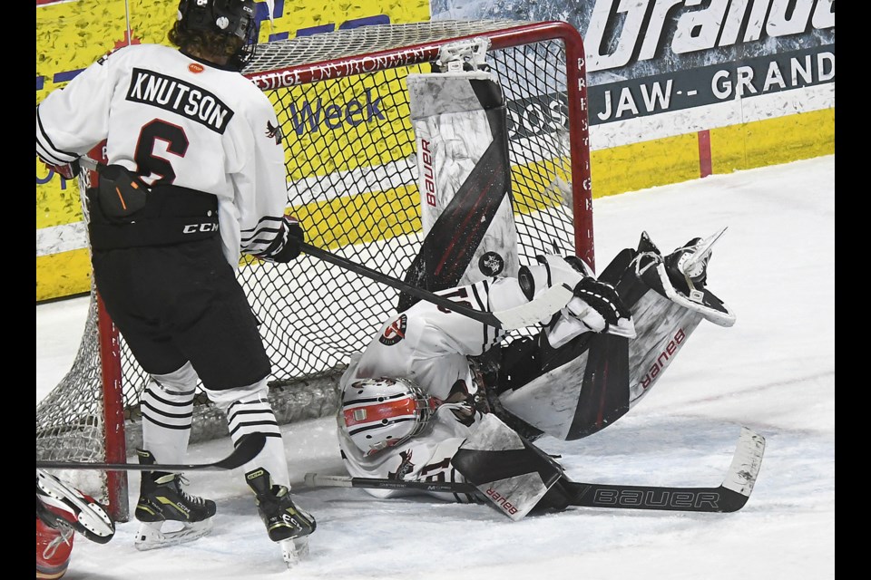 Winmar Warriors goaltender Ryan Bain makes a sprawling save during second period action against Tisdale.