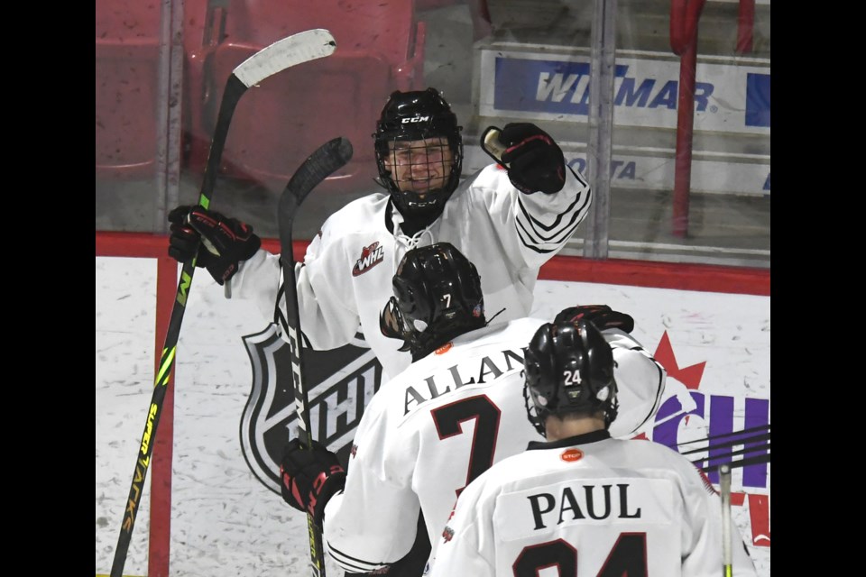 Warriors forward Connor Miller celebrates after scoring the Warriors’ fifth goal.