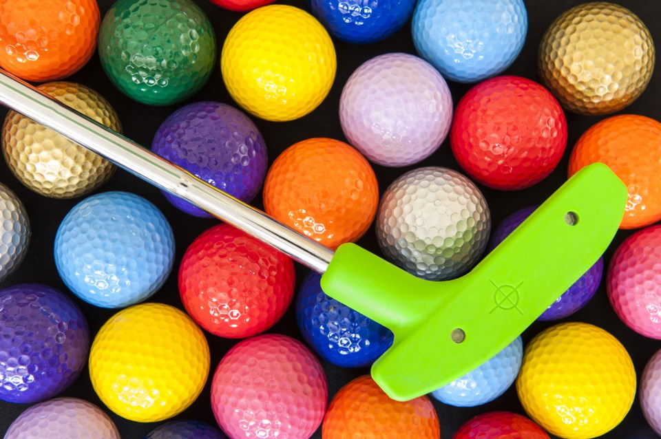 mini golf putter and balls shutterstock