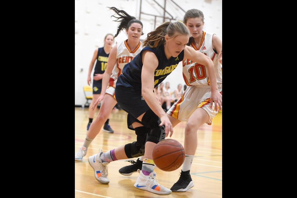 Briercrest Christian Academy guard Melissa Ellis looks to move the ball out of danger against Central’s Nylah Seaborn.