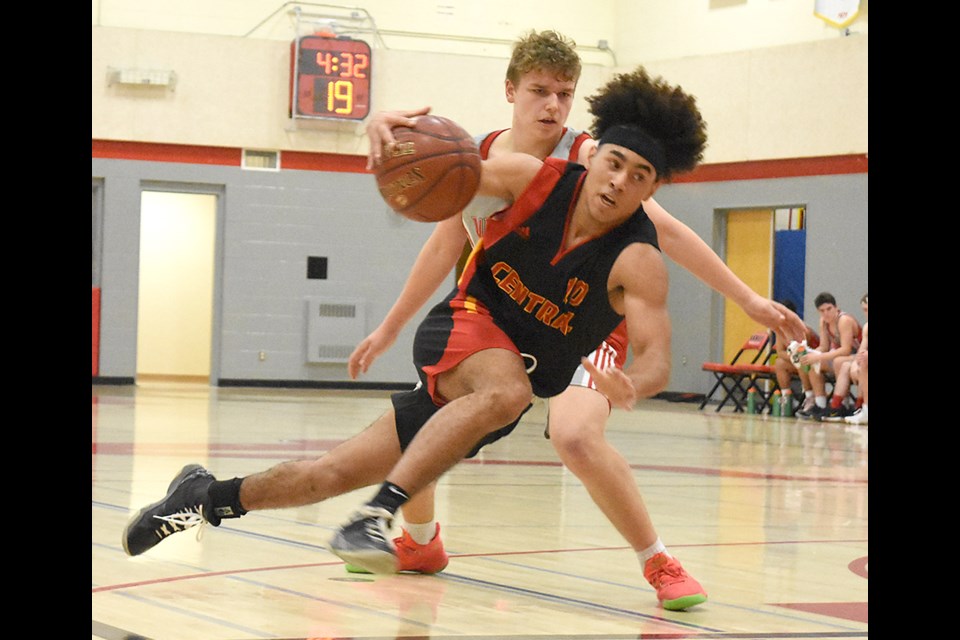 The Cyclone’s Quintin Ross attempts to sneak past Vanier’s Aidan Longworth.