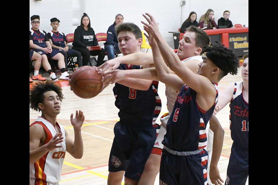 Central’s Jonah Neufeld battles for a rebound with Estevan’s Aden Haywood (8) and Clark Cabiluna (6).