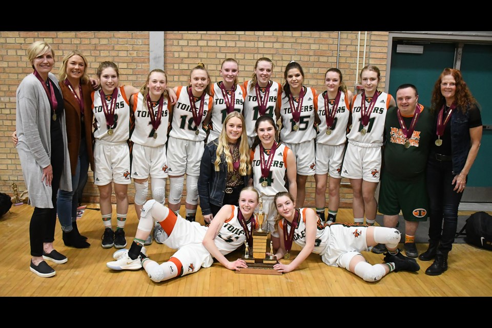 The Peacock Toilers celebrate their 10th straight Moose Jaw high school girls basketball league championship.