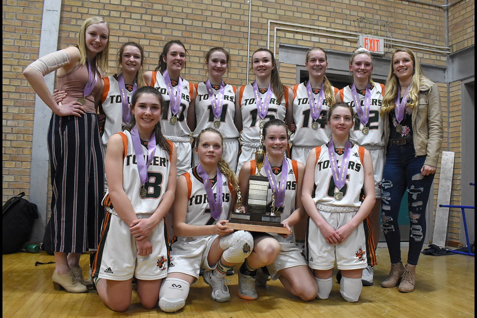 The Peacock Toilers pose with the city championship trophy after winning the league title Tuesday.