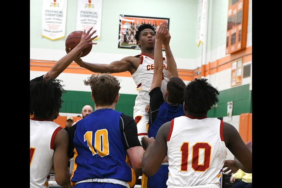 Central’s Mo Jabateh rises above the crowd before putting back a shot.