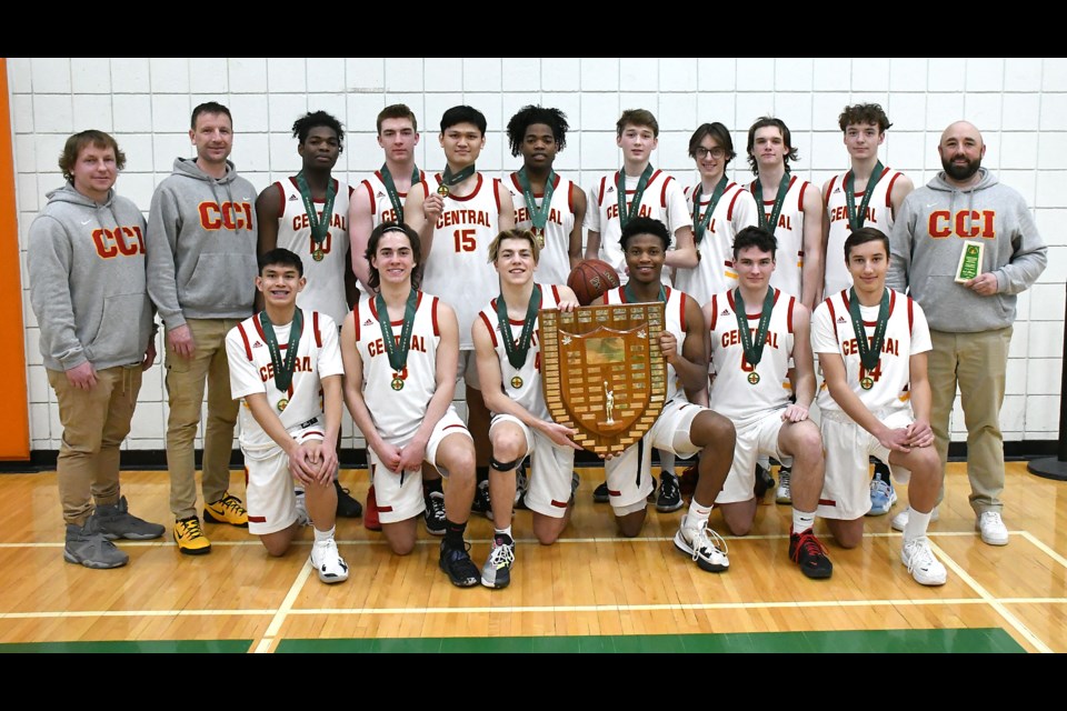 The Central Cyclones gather for a team photo with the SHSAA 4A boys basketball provincial championship plaque.