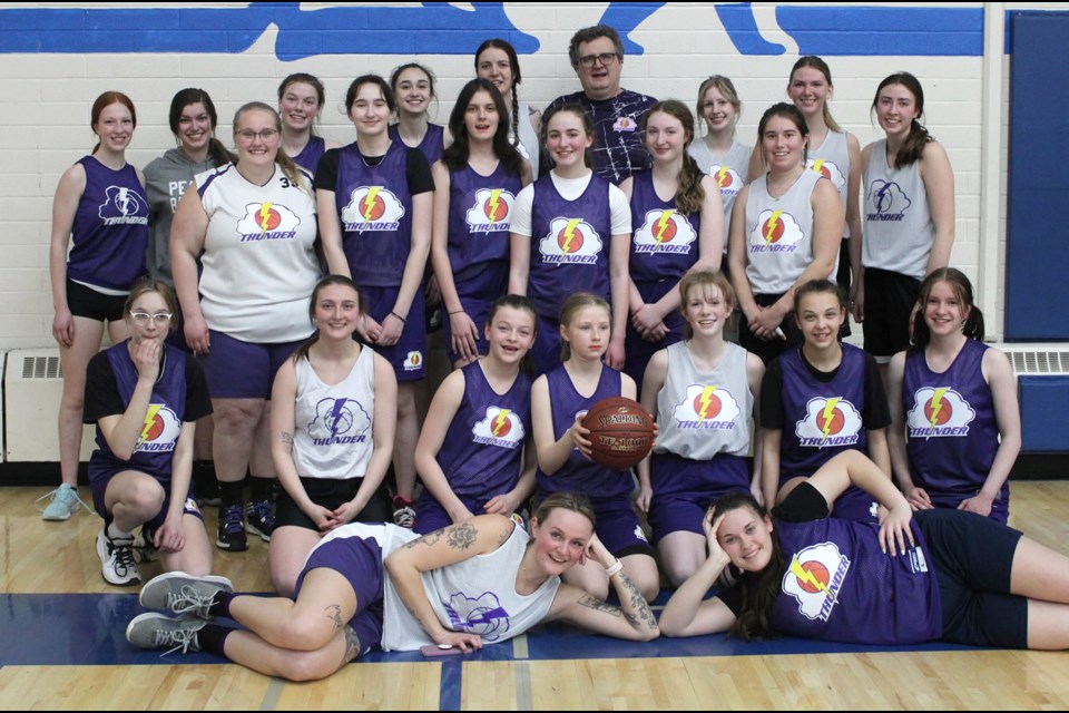 Members of the Moose Jaw Thunder basketball club gather for a photo with the Alumni team after their game. Thunder Facebook