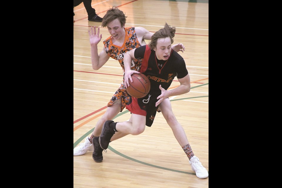 Central’s Kael Nichols drives to the paint around Yorkton’s Johntee Ostapowich.