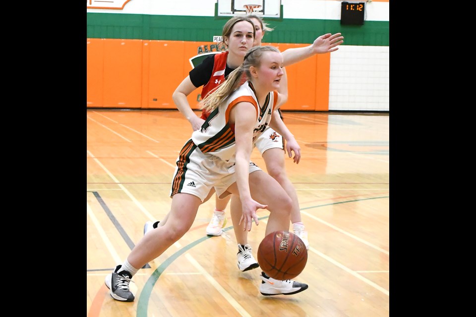 Peacock’s Jessica Selensky drives to the paint against a Notre Dame defender.