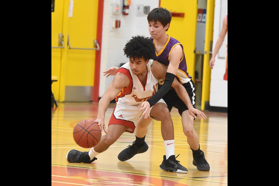 Centrals' Quinton Ross duels La Loche's Daynell Janvier during second half action. And despite how it looks, Ross was uninjured on the play.