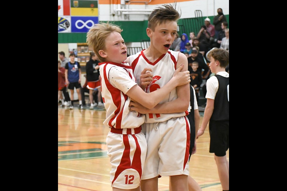 Lex Mohle and Reid Weiss celebrate after Weiss hit a last-second free throw to give the Moose Jaw Spartans the U13 tournament win.