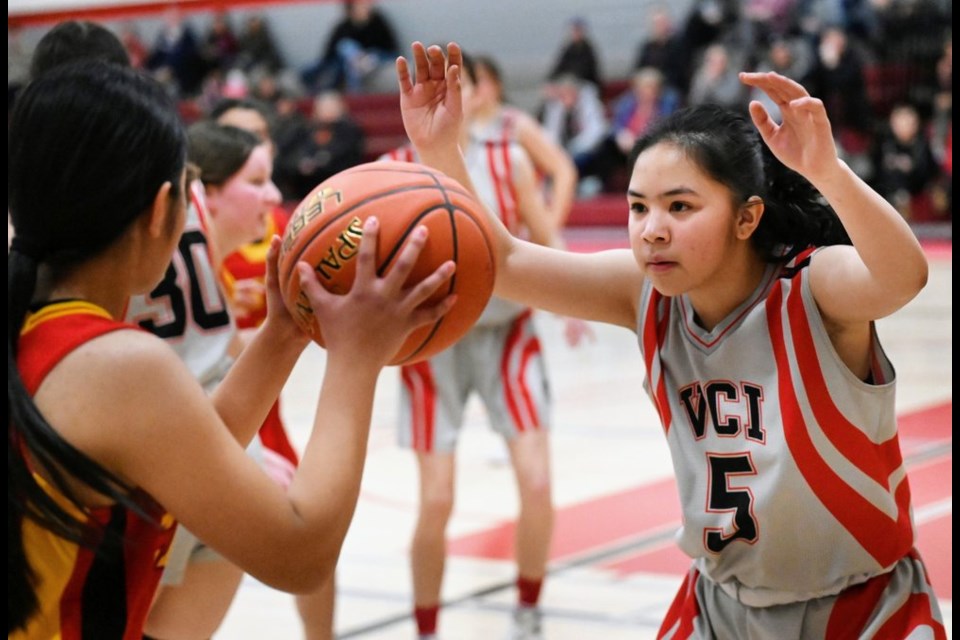 Vanier Spirits Mia Melgarejo attempts to block an opponent from passing to a teammate