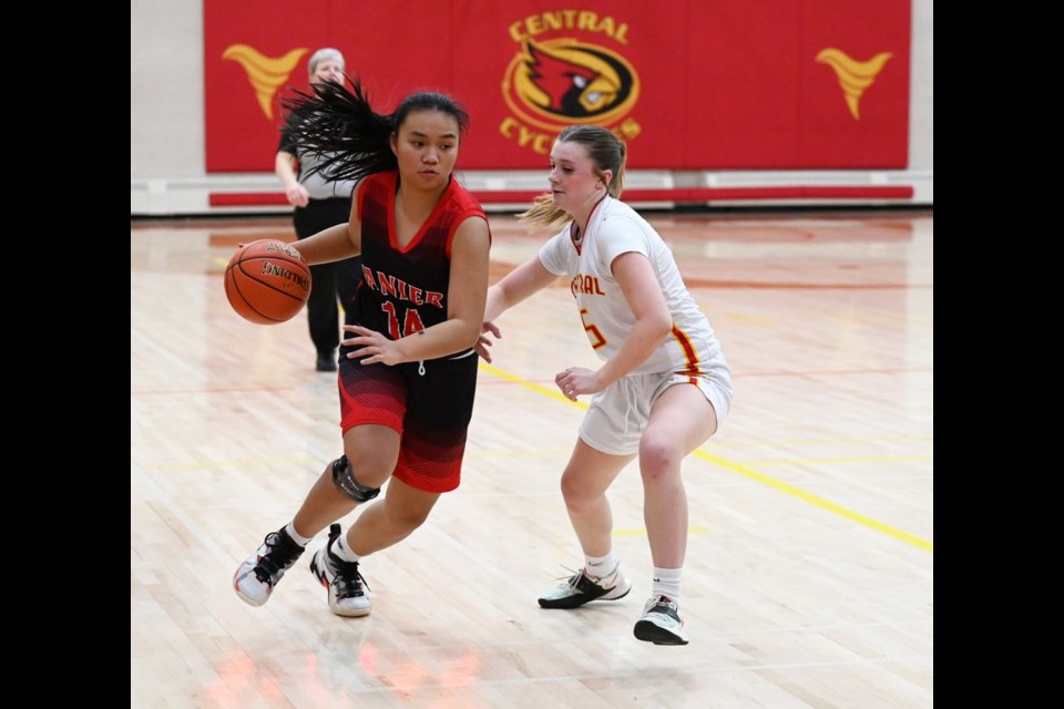 Vanier's Feona Tolentino (left) made numerous fast breaks up the court for the Spirits. Here the Cyclone's Molly McLean tries to contain the rush.