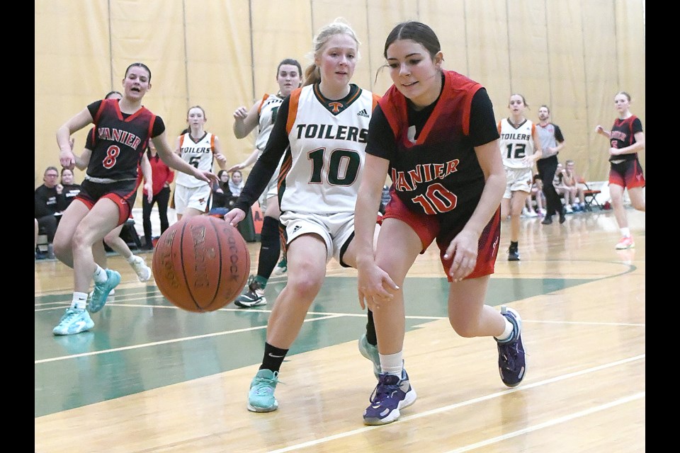 Vanier’s Maddison Cruz and Peacock’s Scout Panko couldn’t quite get to this ball going out of bounds.