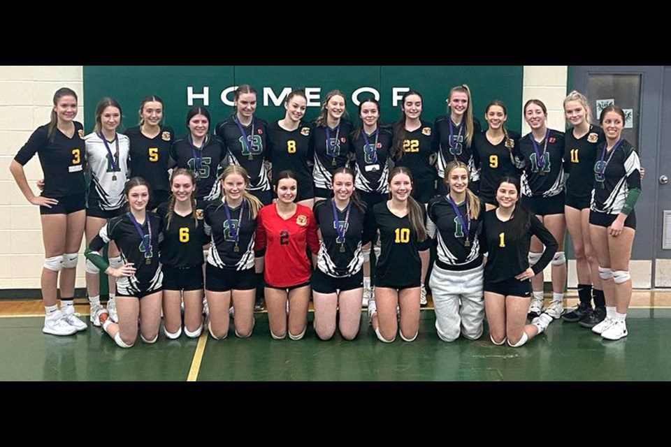 The Central Cyclones gather for a team photo with Lumsden after the two teams qualified for the 4A girls provincial volleyball championship Saturday.