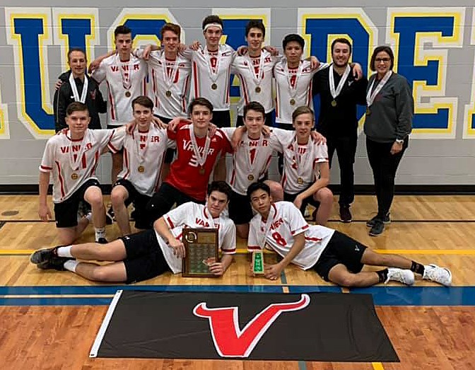 The Vanier Vikings gather for the customary team photo after winning the provincial 4A boys volleyball championship.