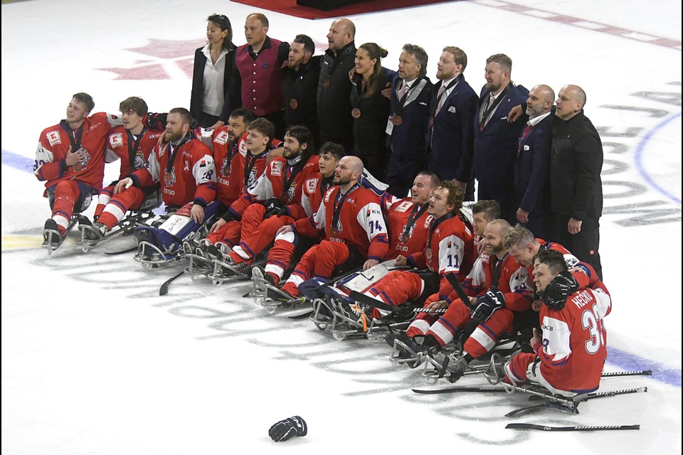 Team Czechia listen to their national anthem after winning the first medal in their country’s history.