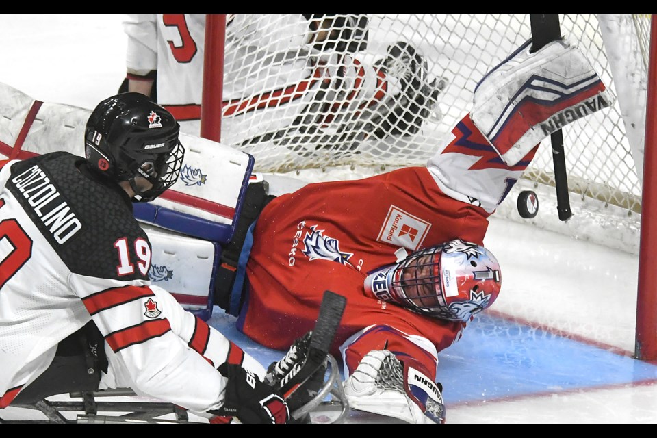 Czechia goaltender Martin Kudela makes a spectacular save on Canada’s Dominic Cozzolino.