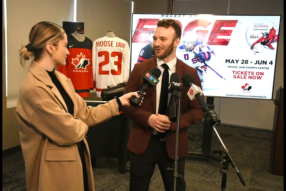 Team Canada captain Tyler McGregor chats with Brit Dort from CTV Regina at the end of the press conference announcing the World Para Hockey Championships coming to Moose Jaw.