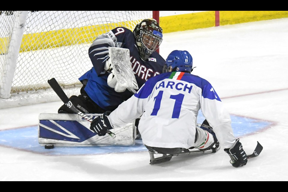 Korea goaltender Choi Hyuk Jun makes a shootout save on Nils Larch.