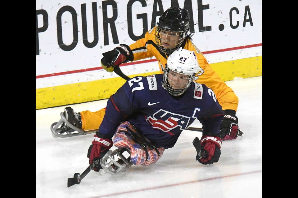 U.S. captain Josh Pauls circles around his net ahead of China’s Zhang Zheng.