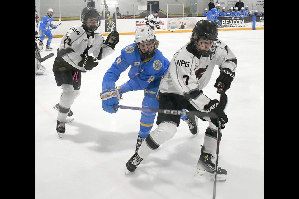 PHA forward Luke Pratte aims to knock the puck away from Rink’s Cohen Lewko.