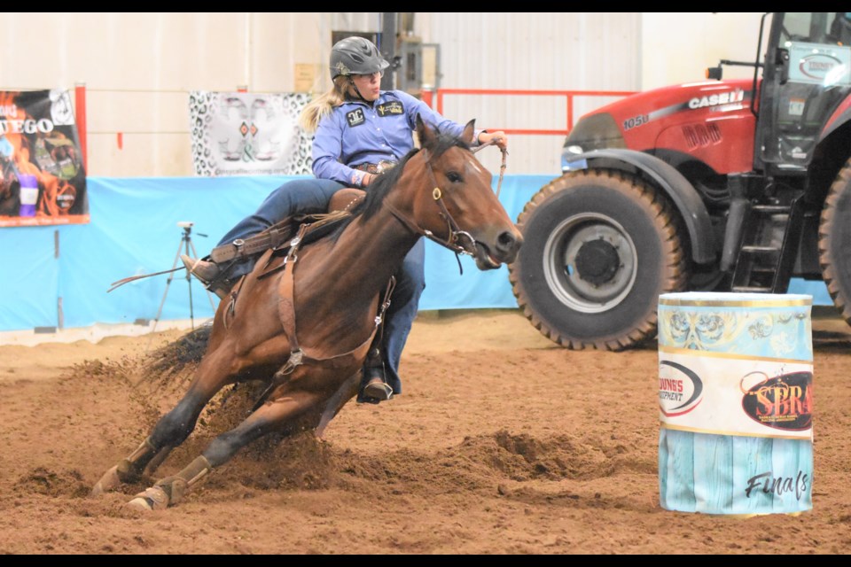 Maple Creek’s Janae Wilson and her horse Lookin’ Haunted loop around one of the barrels before heading to the finish line while competing at provincials in 2019. File photo by Jason G. Antonio