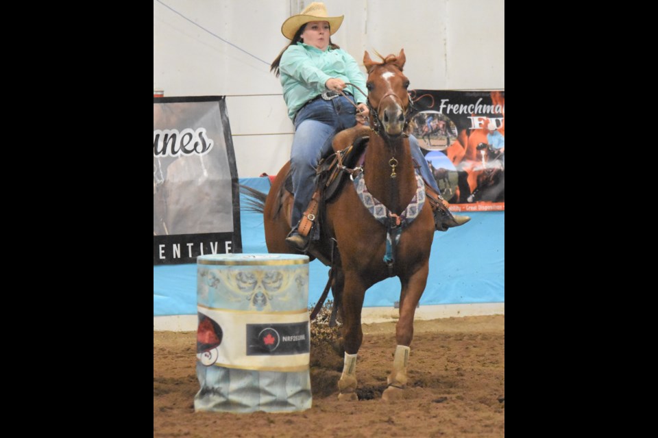 Caronport’s Ashley Chase regains control of her horse Dash for the Win before galloping to the finish line during barrel racing provincials on Aug. 15. Photo by Jason G. Antonio 