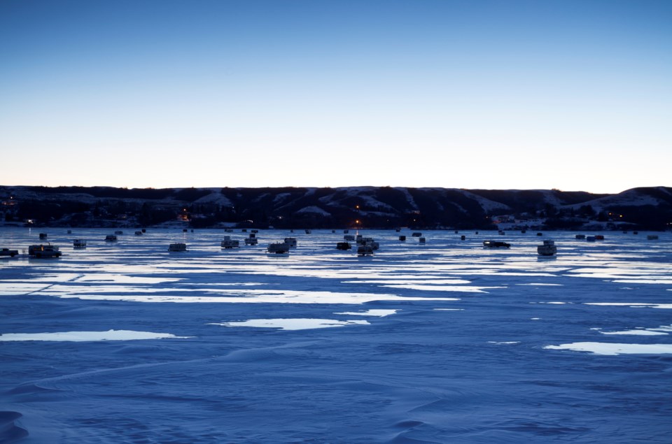 early-morning-ice-fishing-at-buffalo-pound-provincial-park-mysticenergy-istock-getty-images