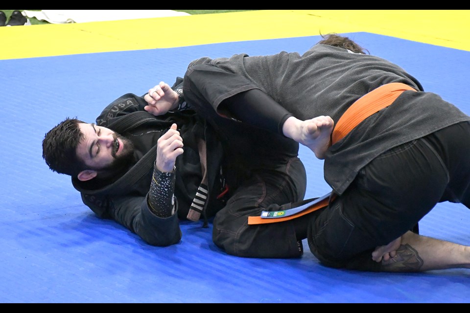 Control Jiu Jitsu competitor Travis Ratzlaff works on the ground against Saskatoon’s Hunter Lee in the men’s Absolute Advanced division final.