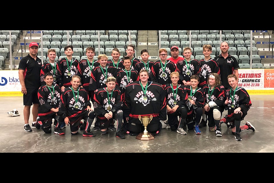 The Moose Jaw Mustangs gather for a team photo with the championship trophy after repeating as the South Sask Lacrosse League Bantam division champions.
