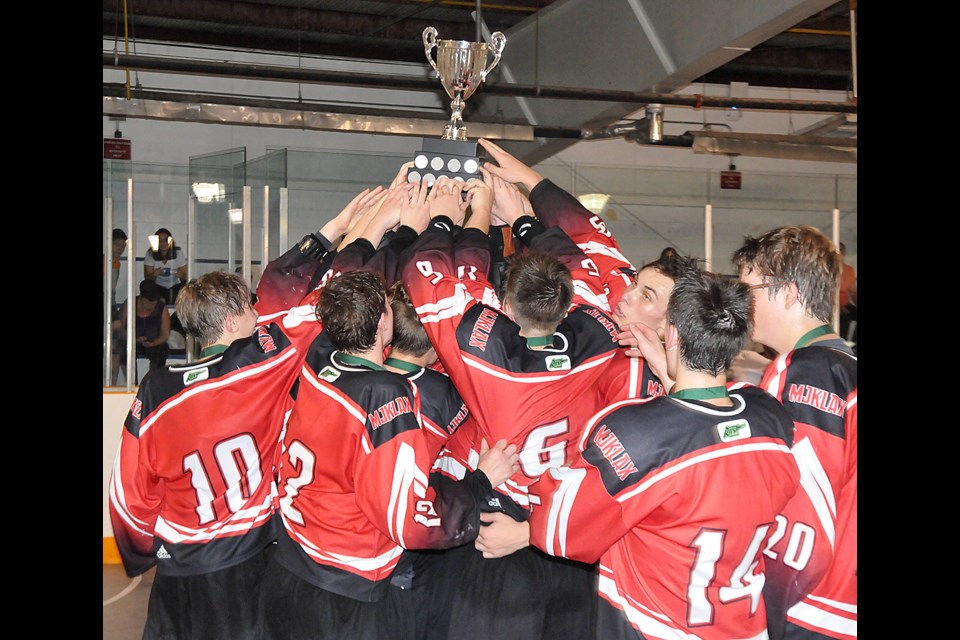 The Midget Mustangs celebrate with the SSLL trophy after their win in the 2018 league final.