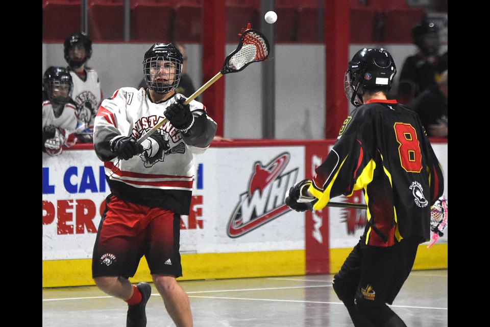 The Mustangs’ Tyson Broomfield passes the ball up the floor against the Thrashers