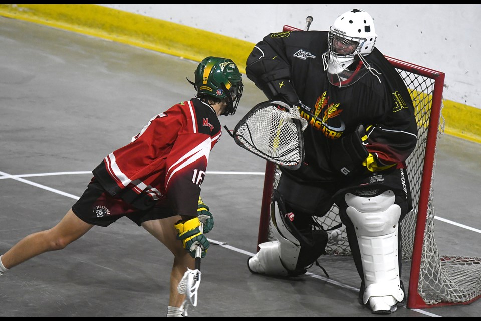 Brodyn Pladson scores Moose Jaw’s seventh goal against Weyburn’s Ben Maloney during the Sask Lacrosse U17 provincial championship on Friday afternoon.