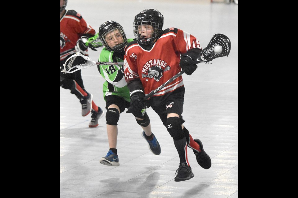 Moose Jaw’s Cooper Fulton absorbs a crosscheck on his way to scoring his team’s seventh goal.